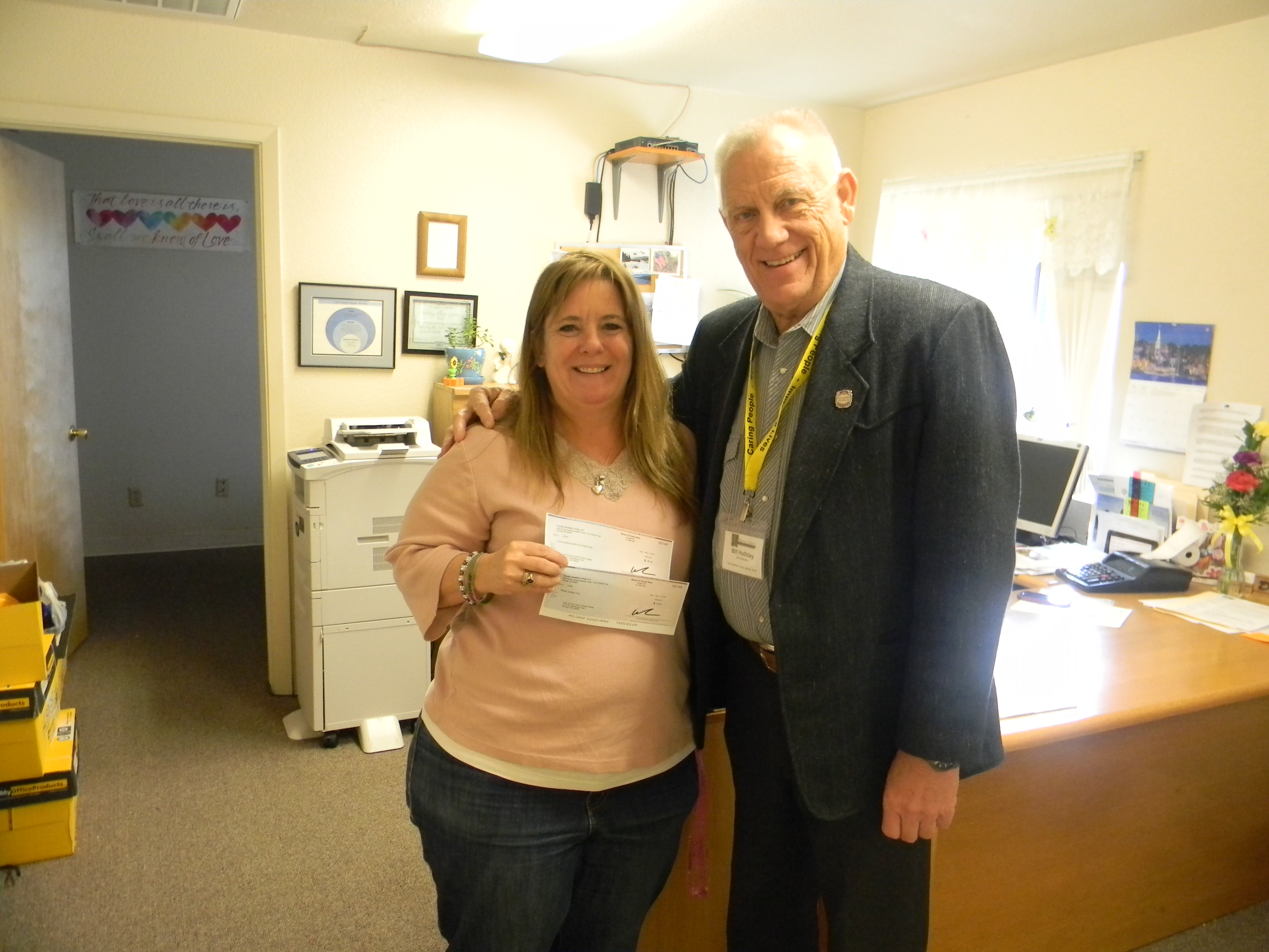 Bill presenting a check to the Senior Center in the amount of $206.00.
